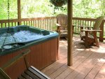 Hot Tub is under the covered porch - perfect for sprinkles or rainy days